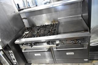 Garland commercial gas range with 6 burners, flat top, 2 ovens, over shelf, and back splash. Used condition.
