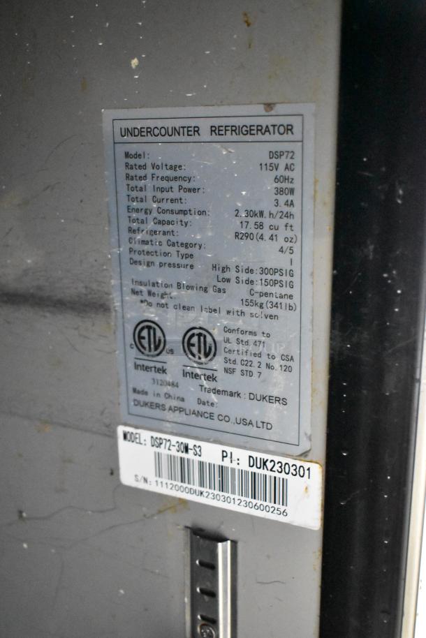 Dukers DSP72 Sandwich Salad Prep Table, 115V, ETL certified, model details label showing specifications and certifications.