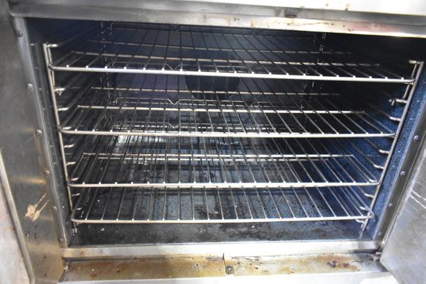 Southbend commercial gas convection oven, full size, view-through door, solid door, thermostatic controls, metal legs.