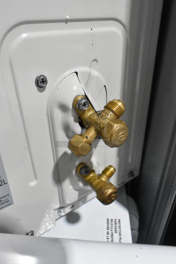 Costway FP10788US air conditioner brass fittings, part of a split type unit. Visible screws and label detail, 208-230V, 1 Phase.