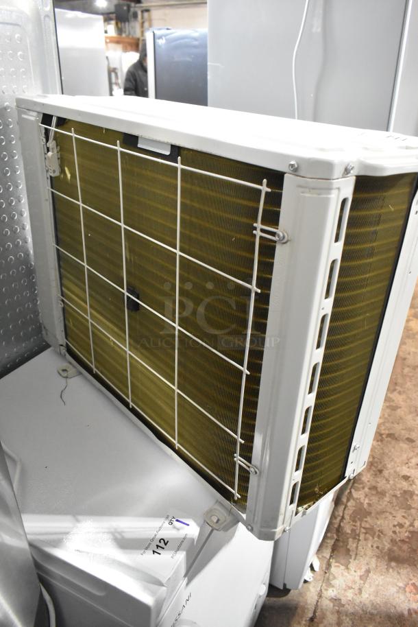 Costway FP10788US Split Type Room Air Conditioner, 208-230V, 1 Phase, shown with protective grille and label, in good condition.