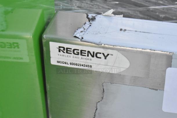 Regency 600S22424SB 2 Bay Sink, brand new with minor dents. Visible label indicating model and brand.