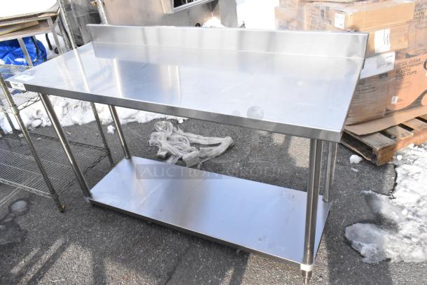 Regency 600TSB2460S stainless steel table with under shelf and backsplash, excellent condition, ideal for kitchen use.