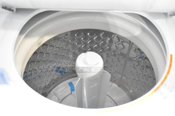 Brand new Frigidaire stacked washer/dryer drum. Top-load washer, pristine condition, minor scratches; 2025 model FLCE7522AW.