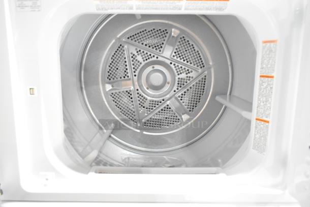 2025 Frigidaire FLCE7522AW stacked washer dryer, brand new, showing interior drum. Scratch and dent condition.