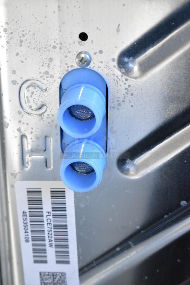 2025 Frigidaire FLCE7522AW washer and dryer connections, model label visible, scratch-dent condition, new.