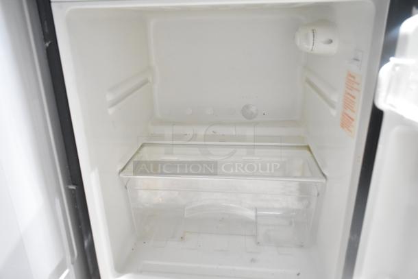 Brand new Magic Chef HMDR310SE mini cooler with freezer, scratch and dent condition, 115 volts, 1 phase, interior view.