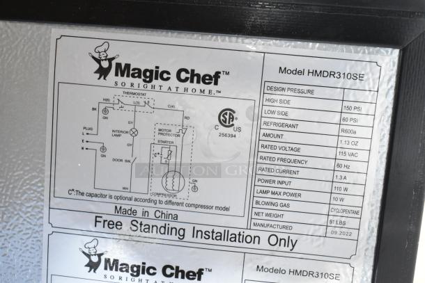 Magic Chef HMDR310SE Mini Cooler with freezer label details, showing specs and installation instructions. Brand new condition.