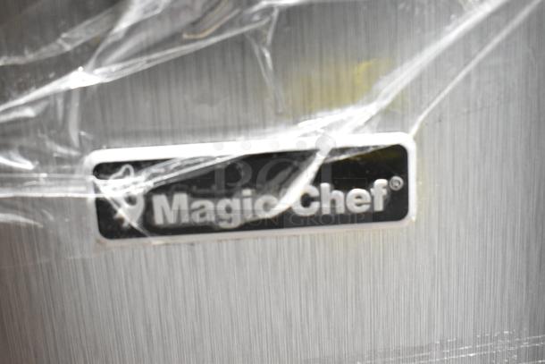 Magic Chef HMDR310SE mini cooler with freezer, brand new, scratch and dent. Label visible, wrapped in protective plastic.