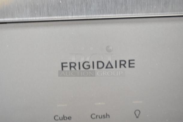 BRAND NEW SCRATCH AND DENT Frigidaire FRSS2623ASN fridge label, featuring French doors, drawer freezer, water/ice dispenser.