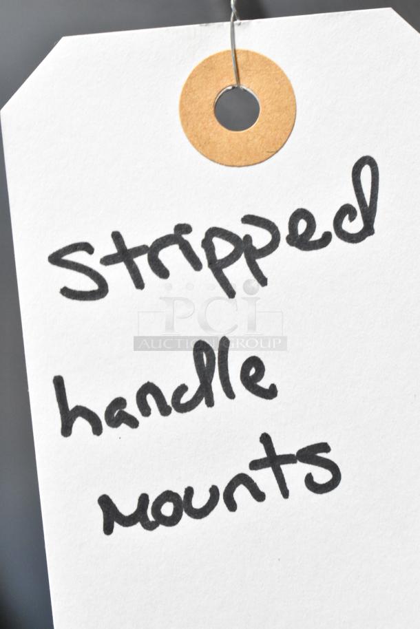 Label noting "stripped handle mounts" on the Frigidaire FRSS2623ASN refrigerator.