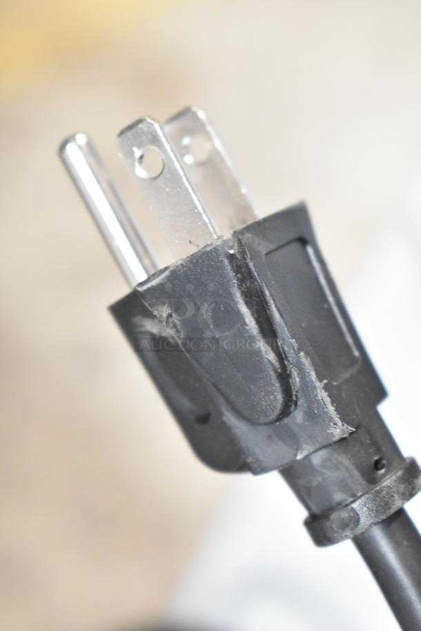 Close-up of the power plug for a 2025 Vissani HVAR43GSE mini cooler, 115 volts, 1 phase, new with slight defects.