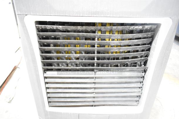 Hessaire MC37V Mobile Evaporative Cooler, visible front grill, 110-120 Volts, showing used condition.