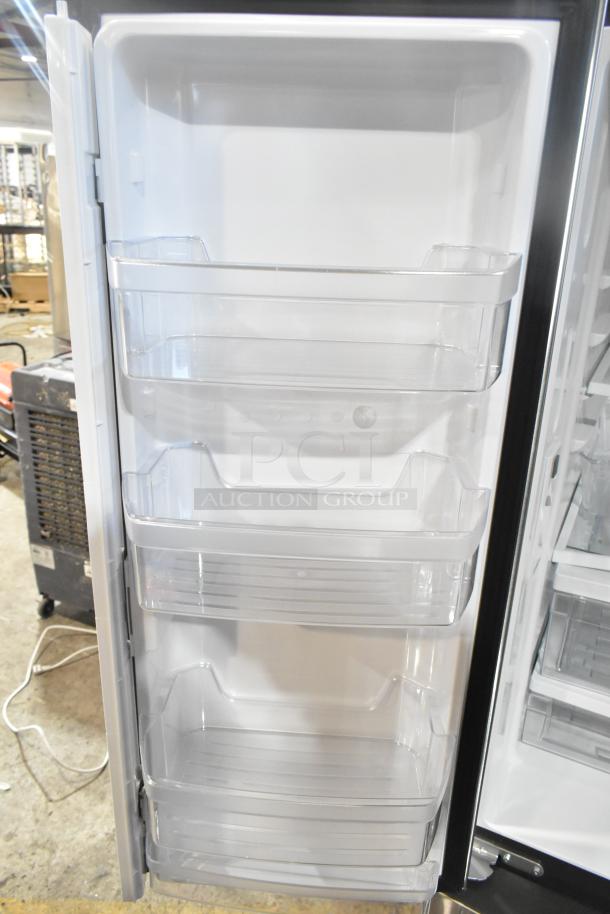 BRAND NEW SCRATCH AND DENT! GE GNE27JYMYFFS French Door Refrigerator interior, clear adjustable door bins visible.
