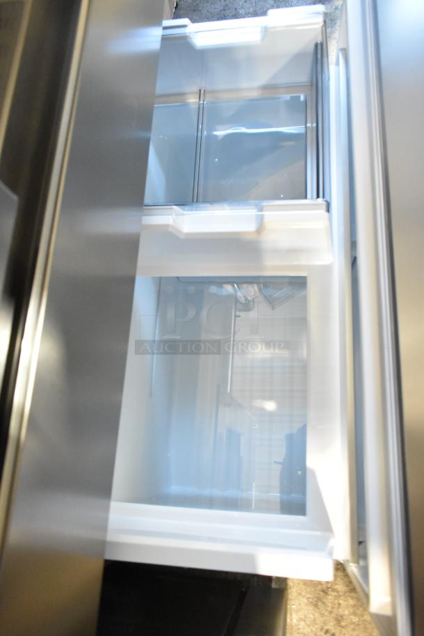 Brand new Frigidaire Professional French door cooler with drawer freezer, water/ice dispenser. Scratch and dent model.