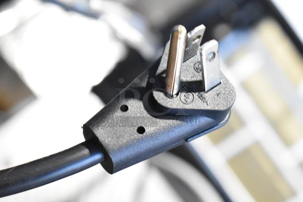 Close-up of a three-prong power plug on a new Frigidaire Professional French Door Cooler. Model supports 115 Volts, 1 Phase.