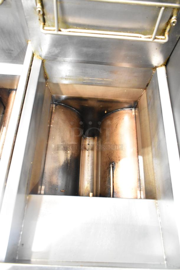 Frymaster GF40SD commercial gas fryer interior, showing stainless steel construction and wear from use.