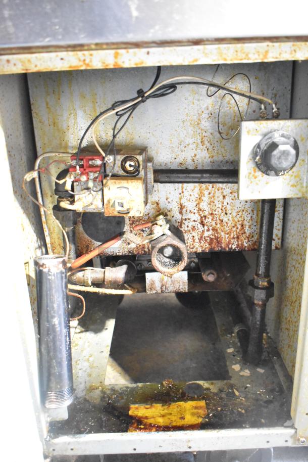 Frymaster GF40SD commercial gas fryer, interior view, showing mechanical parts and wear, 122,000 BTU capacity.