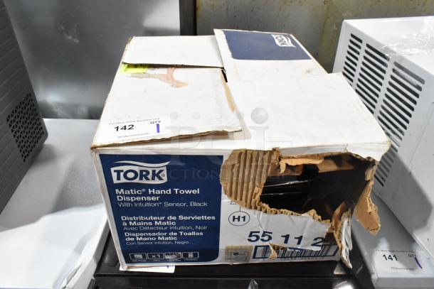 BRAND NEW SCRATCH AND DENT! Tork 55 11 281 paper towel dispenser in damaged box, features Intuition sensor, black color.
