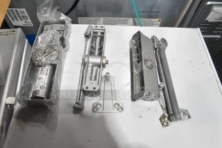 3 various items including an Ingersoll-Rand 4041 and Norton 1601 door closer, each in good condition with visible labels.