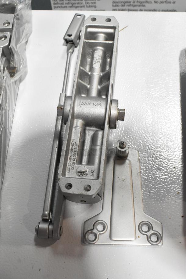 Ingersoll-Rand 4041 closer, metal body, shown with mounting hardware. Fine condition, USA made, suitable for commercial doors.