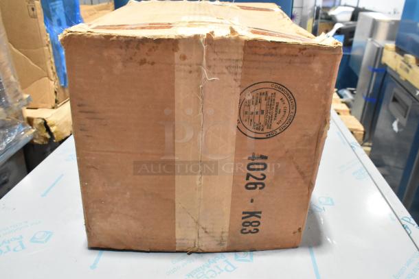 Cardboard box with "BRAND NEW SCRATCH AND DENT" labeling for a metal rack for Winston Pressure Fryer. Box shows signs of wear.