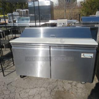 Avantco 178SSPT60HC refrigerated prep table with cutting board, two doors, two racks, on casters; 60x30.5x43.5 inches.