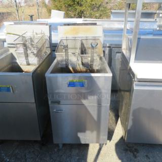 Pitco natural gas deep fryer, model 65C+, with 2 baskets. Dimensions: 20x34x46 inches. Good condition.