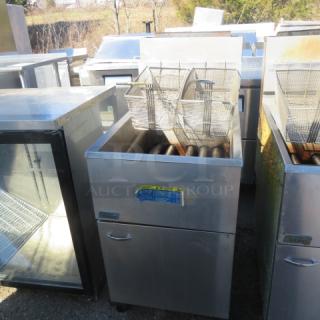 Pitco Natural Gas Deep Fryer Model 65C+ with two baskets, stainless steel, size 20x34x46 inches, visible label, used condition.