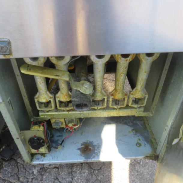 Pitco Model 65C+ natural gas deep fryer with two baskets, dimensions 20x34x46 inches, showing interior components.