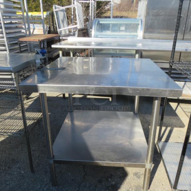 Stainless steel table with under shelf, 10lb can opener attached, 36x36x34, commercial use, durable condition.