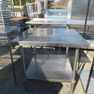 Stainless steel table with under shelf, 10lb can opener attached, 36x36x34, commercial use, durable condition.