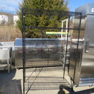 Black Metro shelf with six adjustable wire shelves, dimensions 48x24x75 inches, in used condition.