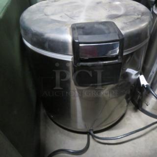 Tiger 50 Cup Rice Warmer, Model THC-90UA, 120 Volt, stainless steel finish, visible power cord, used condition.