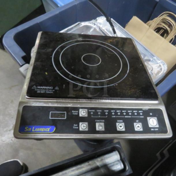 Sir Lawrence Induction Range, 120 Volt, with digital controls and function buttons. Used condition, visible branding.