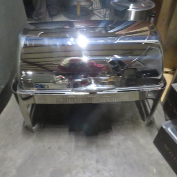 Heavy duty stainless steel full-size roll-top chafer, highly polished, excellent condition, ideal for catering events.
