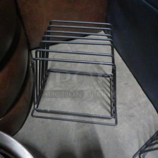 Wire pan holder, model 2XBID, in good condition. Metal construction with multiple slots for pans. Ideal for kitchen use.