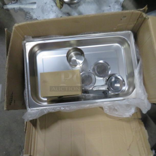 New full-size chafer in box, stainless steel, includes fuel holders and frame, brand new condition, model 2XBID.