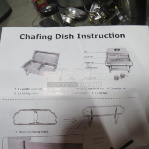 NEW Full Size Chafer. Includes folding stand, water pan, and food pans. Instructions visible with assembly guide.