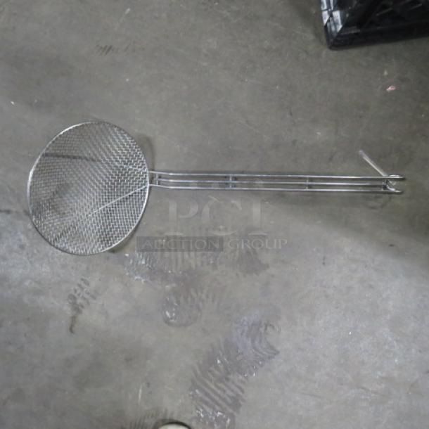 Stainless steel deep fry scoop with long handle, wire mesh design, suitable for frying, in good condition.