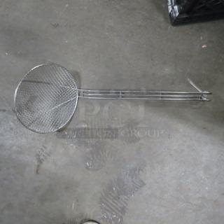 Stainless steel deep fry scoop with long handle, wire mesh design, suitable for frying, in good condition.