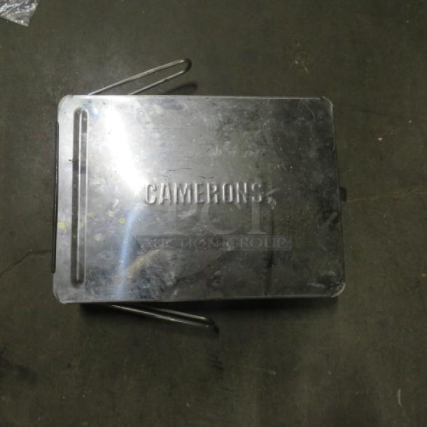Camerons stainless steel stovetop smoker in used condition; "CAMERONS" engraved on the lid.