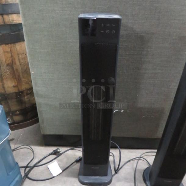 Pelonis Tower Ceramic Heater PHT30D7BBB, 1500W, 120V, sleek black design, control panel, good condition, priced at $91.99.