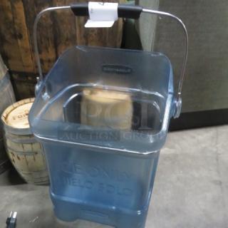 Transparent blue plastic ice bucket with handle, labeled "ICE ONLY," in good condition. Ideal for parties or events.