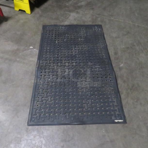 Black fatigue mat, size 33x55 inches. Features a textured, anti-slip surface. Appears in used condition.