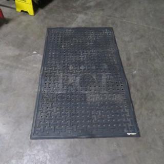 Black fatigue mat, size 33x55 inches. Features a textured, anti-slip surface. Appears in used condition.
