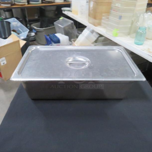 Full-size 6-inch deep hotel pan with lid, stainless steel, in good condition, perfect for commercial kitchen use.