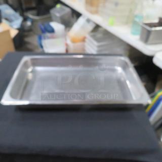 Full-size 2.5-inch deep hotel pan, stainless steel construction, used condition, with reflective surface. Suitable for catering.