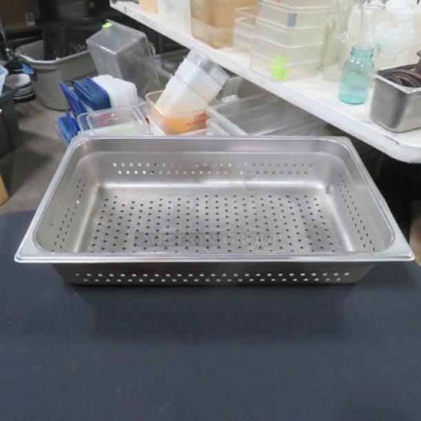 Full-size 4-inch deep perforated hotel pan, stainless steel, excellent condition, ideal for steam table use.
