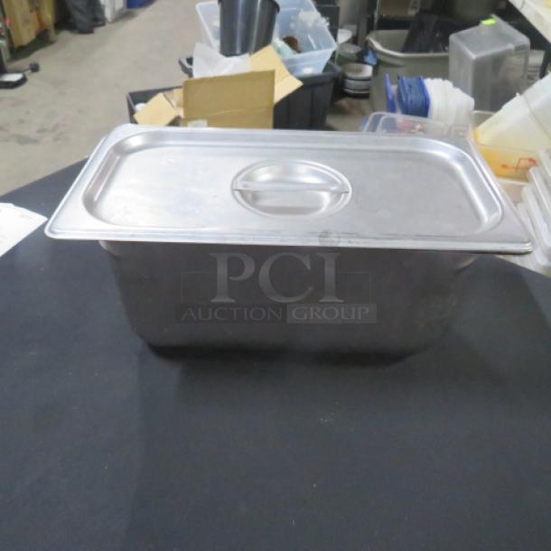 1/3 Size 6 Inch Deep Hotel Pan with Lid, stainless steel, used condition. Ideal for commercial kitchen use.